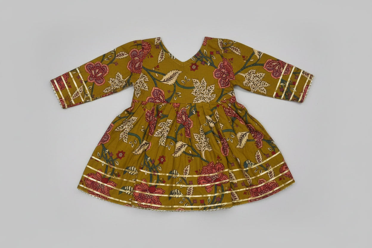 Floral patterned dress on a textured white surface