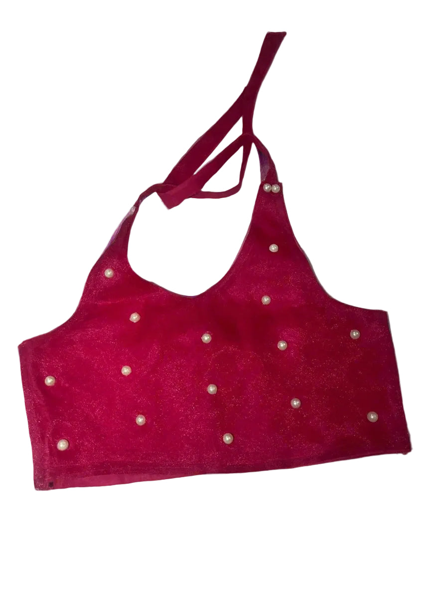 Red bralette with pearl-like embellishments on a light gray background