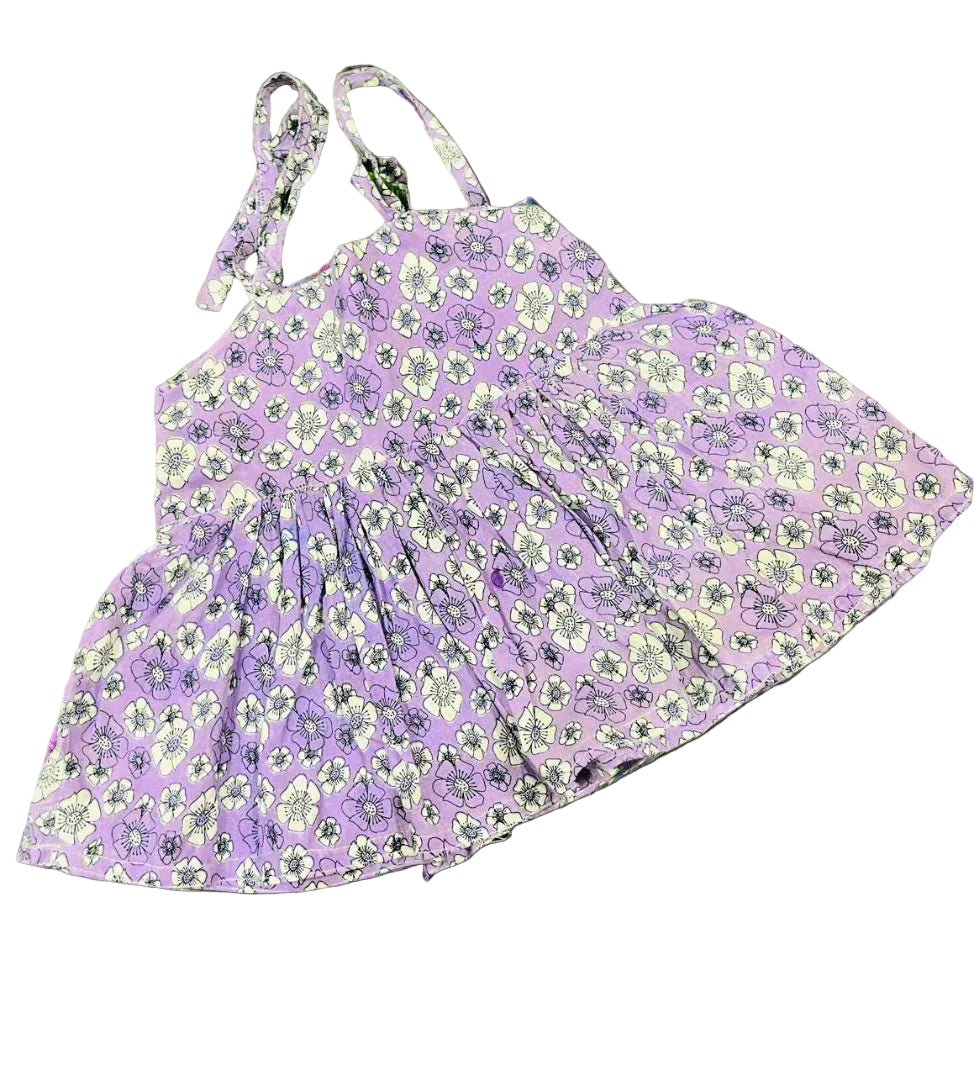 Purple floral dress on a gray background