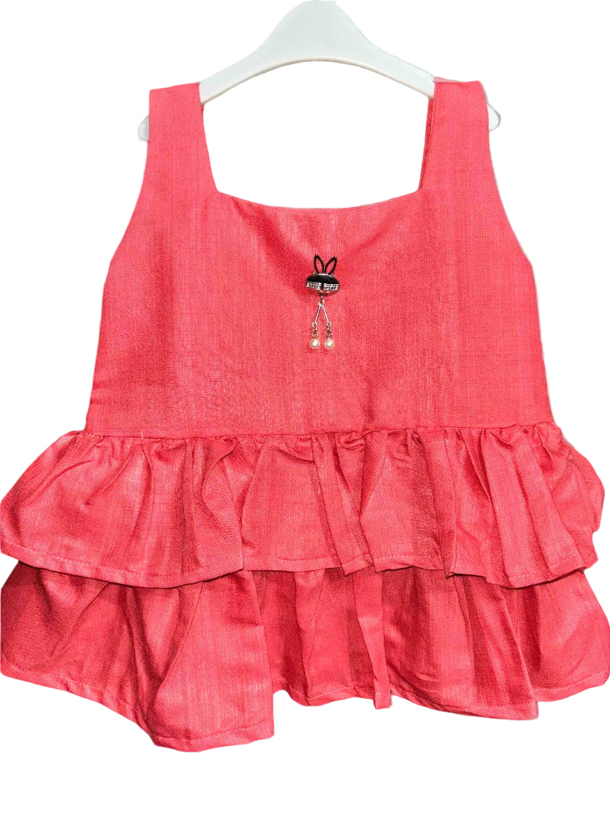 Red ruffled dress on a gray background