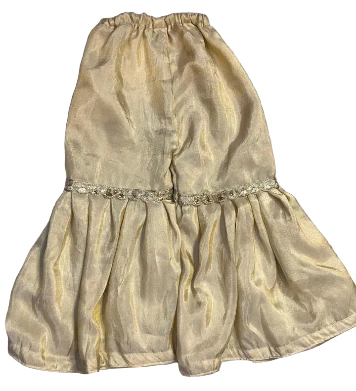 Gold dress with a decorative belt on a gray background