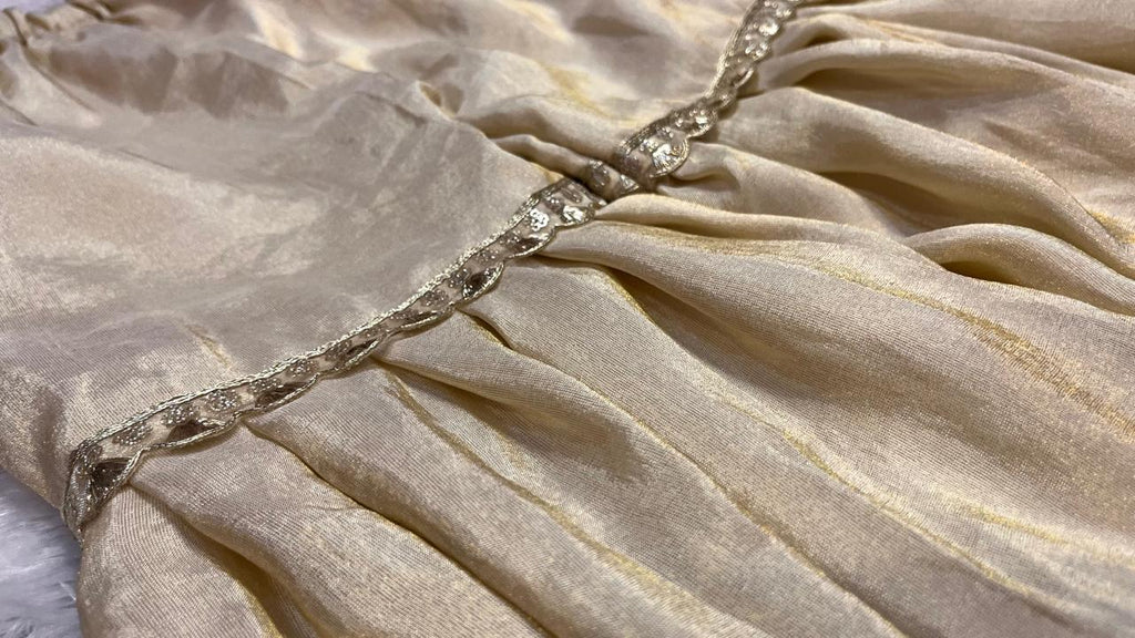 Close-up of beige fabric with decorative trim